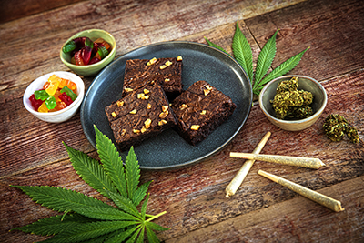 Image of cannibis joints, gummies, and flower.